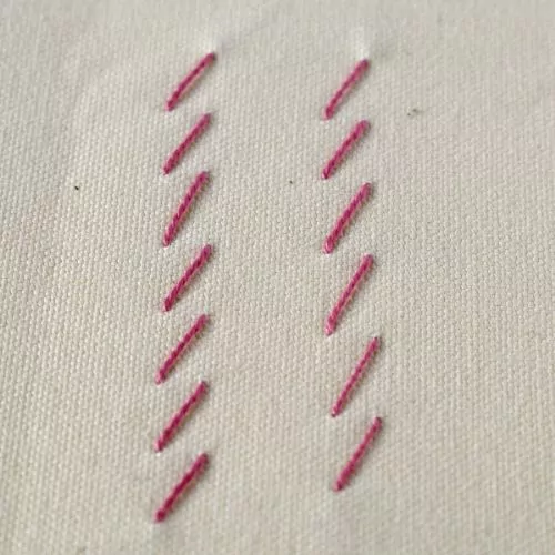 Broderie au point de fouet avec coton perlé rose